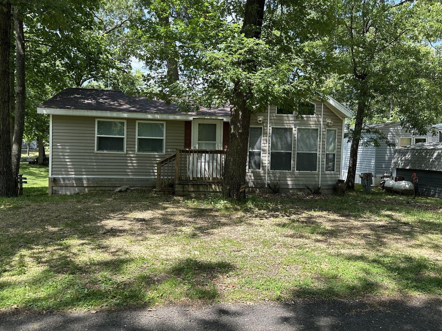 3-71 Woodhaven Lakes Sublette, IL 61367 - Photo 7 of 27 a backyard of a house with yard and barbeque oven