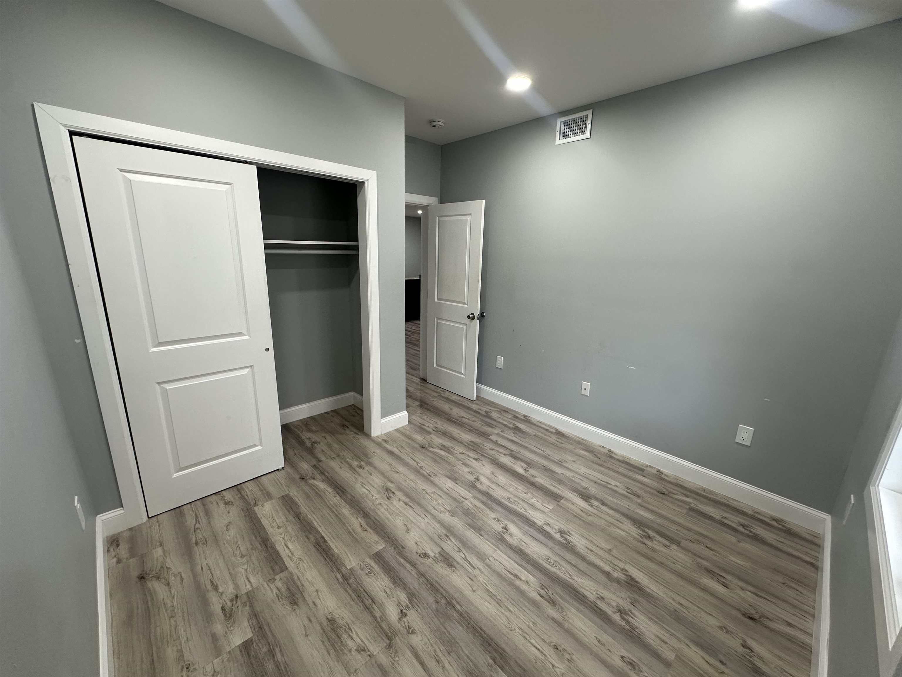 514 43rd Street, Unit 2 Union City, NJ 07087 - Photo 14 of 14 an empty room with closet and wooden floor