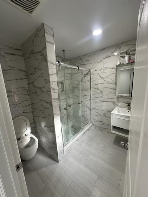 514 43rd Street, Unit 2 Union City, NJ 07087 - Photo 4 of 14 a bathroom with a shower and a toilet