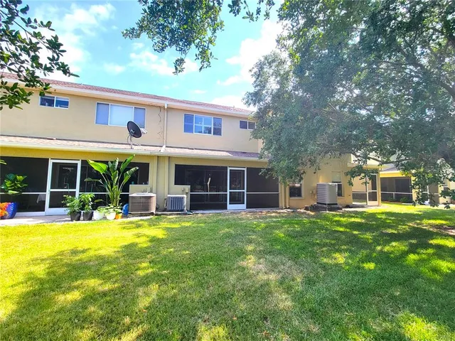 a view of a house with a yard porch and sitting area