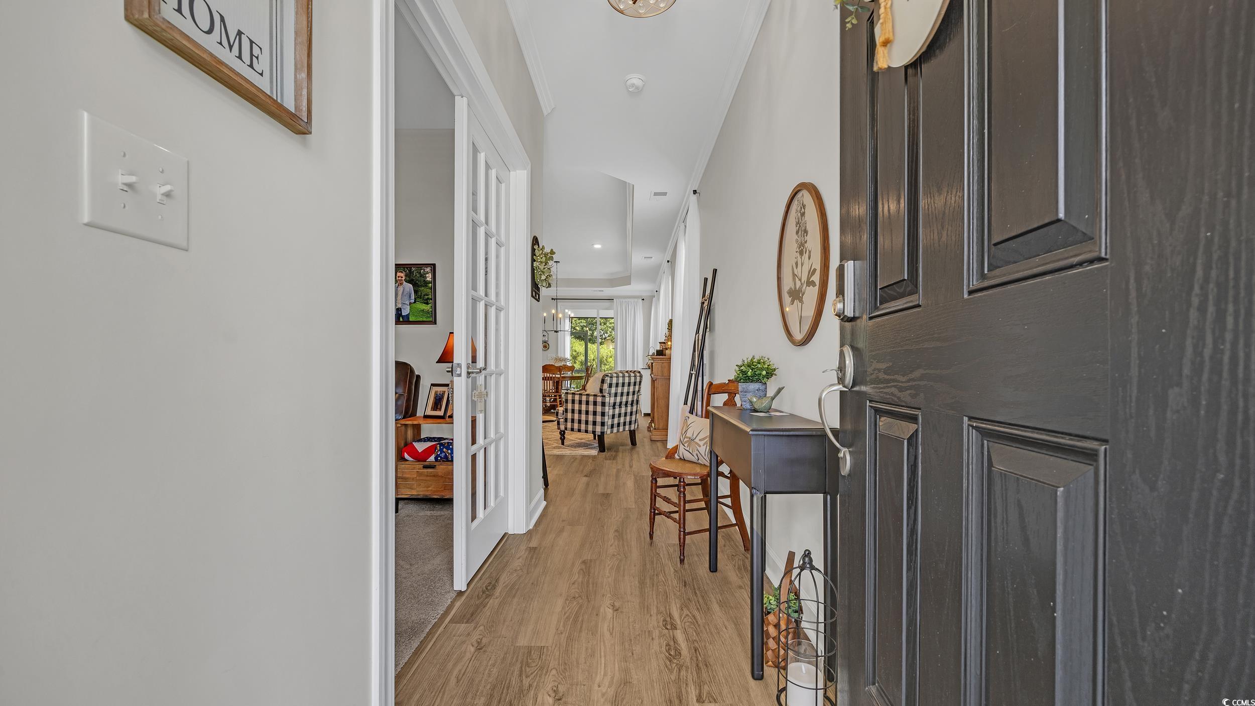 598 Cascade Loop Little River, SC 29566 - Photo 4 of 40 Foyer entrance with light wood-style floors and fr