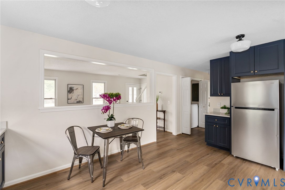 11345 Walton Lake Road Disputanta, VA 23842 - Photo 14 of 37 a dining room with furniture and wooden floor