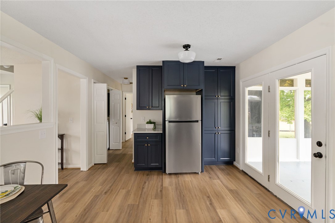 11345 Walton Lake Road Disputanta, VA 23842 - Photo 15 of 37 a view of a kitchen with refrigerator and wooden floor