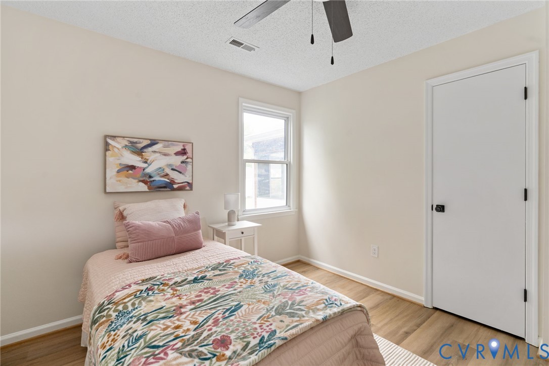 11345 Walton Lake Road Disputanta, VA 23842 - Photo 18 of 37 a bedroom with a bed and a window