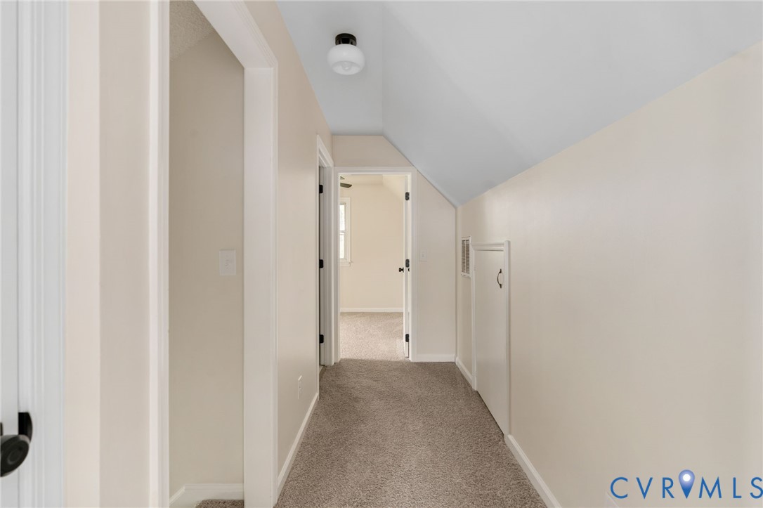 11345 Walton Lake Road Disputanta, VA 23842 - Photo 24 of 37 a view of a hallway with wooden floor