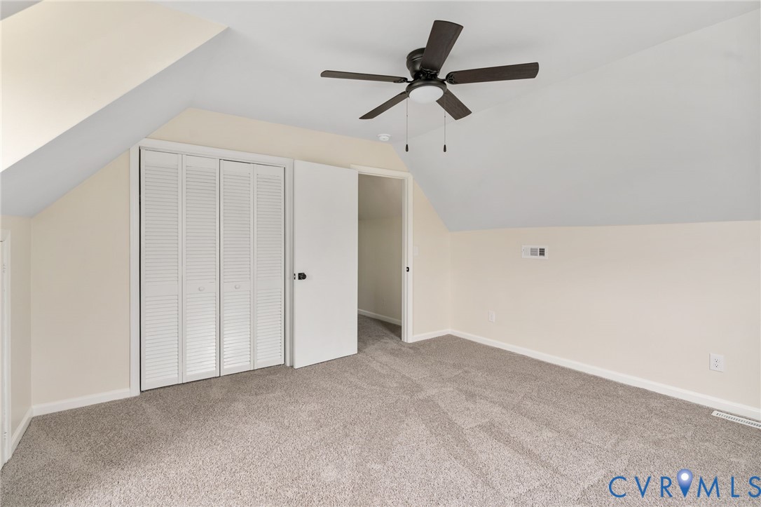 11345 Walton Lake Road Disputanta, VA 23842 - Photo 26 of 37 a view of a ceiling fan in a room