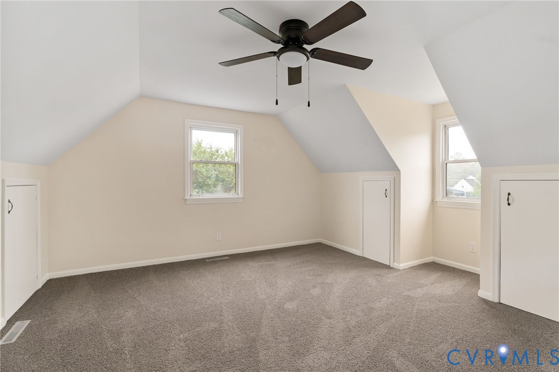 11345 Walton Lake Road Disputanta, VA 23842 - Photo 28 of 37 an empty room with windows and fan