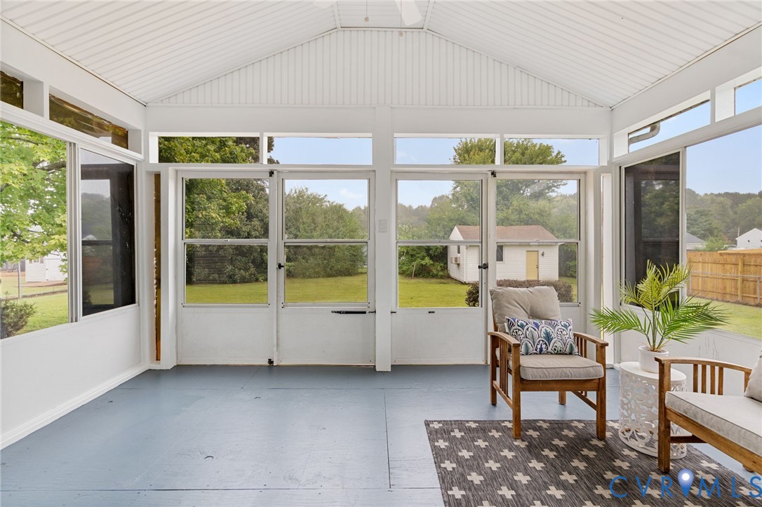 11345 Walton Lake Road Disputanta, VA 23842 - Photo 32 of 37 a living room filled with furniture and a large window