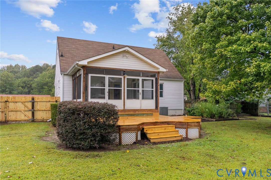 11345 Walton Lake Road Disputanta, VA 23842 - Photo 33 of 37 a house view with sitting space and garden