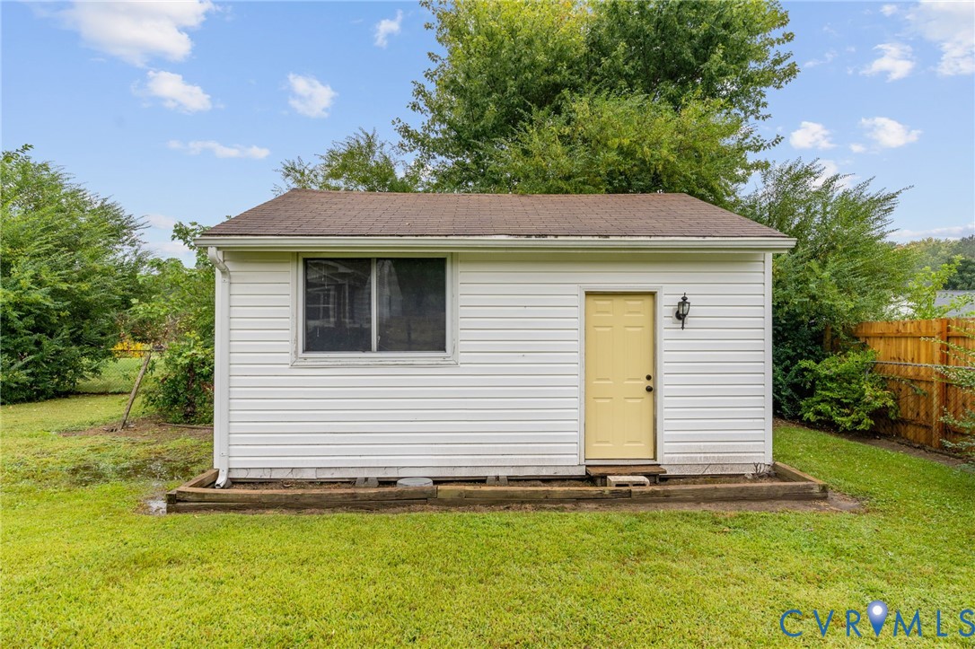 11345 Walton Lake Road Disputanta, VA 23842 - Photo 36 of 37 a view of a white house with a yard