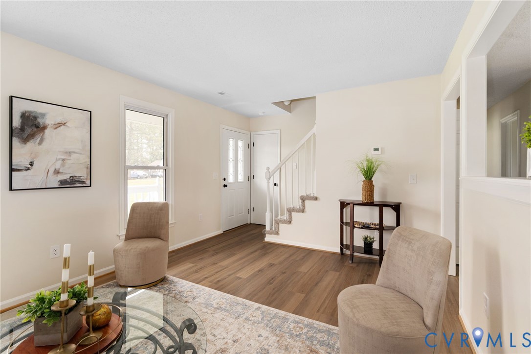 11345 Walton Lake Road Disputanta, VA 23842 - Photo 7 of 37 a living room with furniture and wooden floor