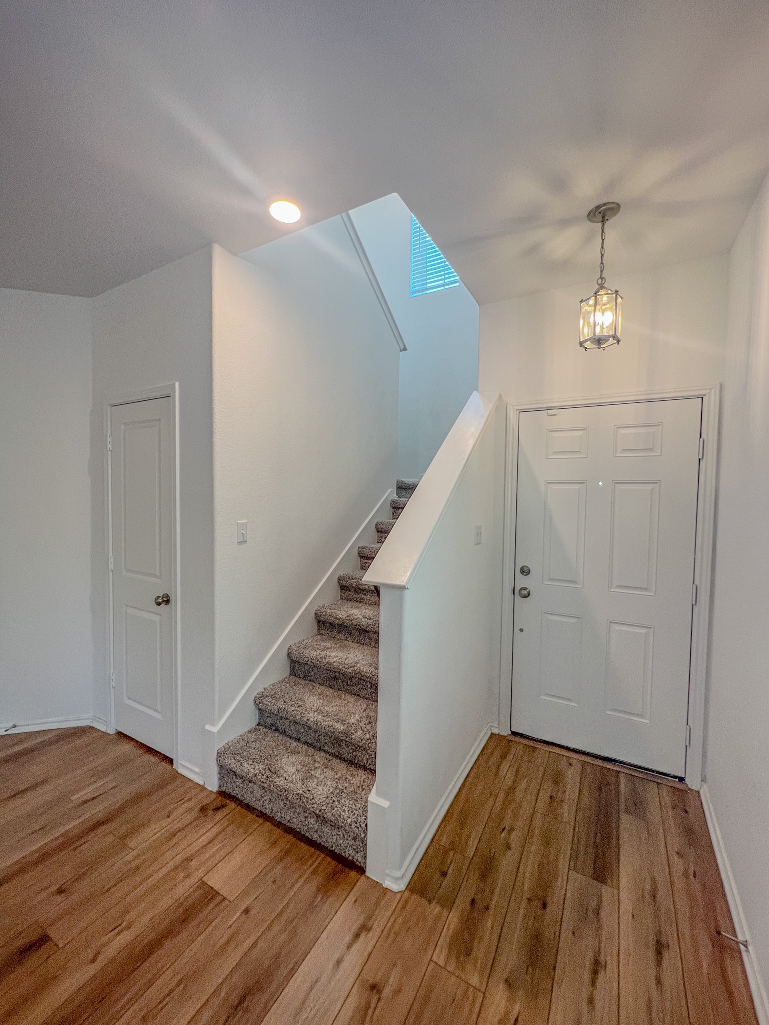 438 Perfect World Loop Jarrell, TX 76537 - Photo 16 of 35 a view of a livingroom with wooden floor and staircase