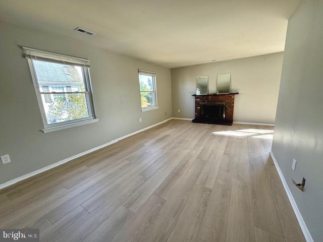 115 Willow Turn Mount Laurel, NJ 08054 - Photo 4 of 13 a view of an empty room with wooden floor and a window