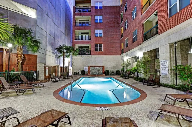 a living room with blue lights with furniture and wooden floor