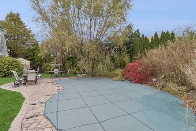 a view of a backyard with sitting area
