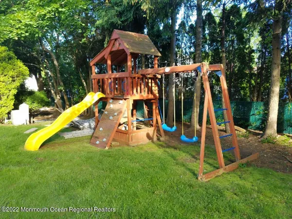 a view of a park with slide and a slide