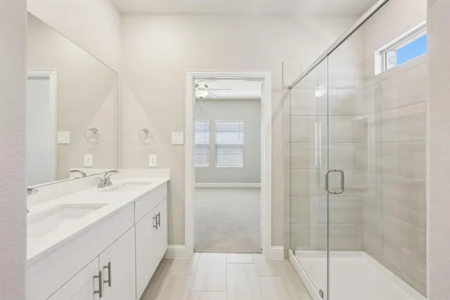 a spacious bathroom with a shower and a sink