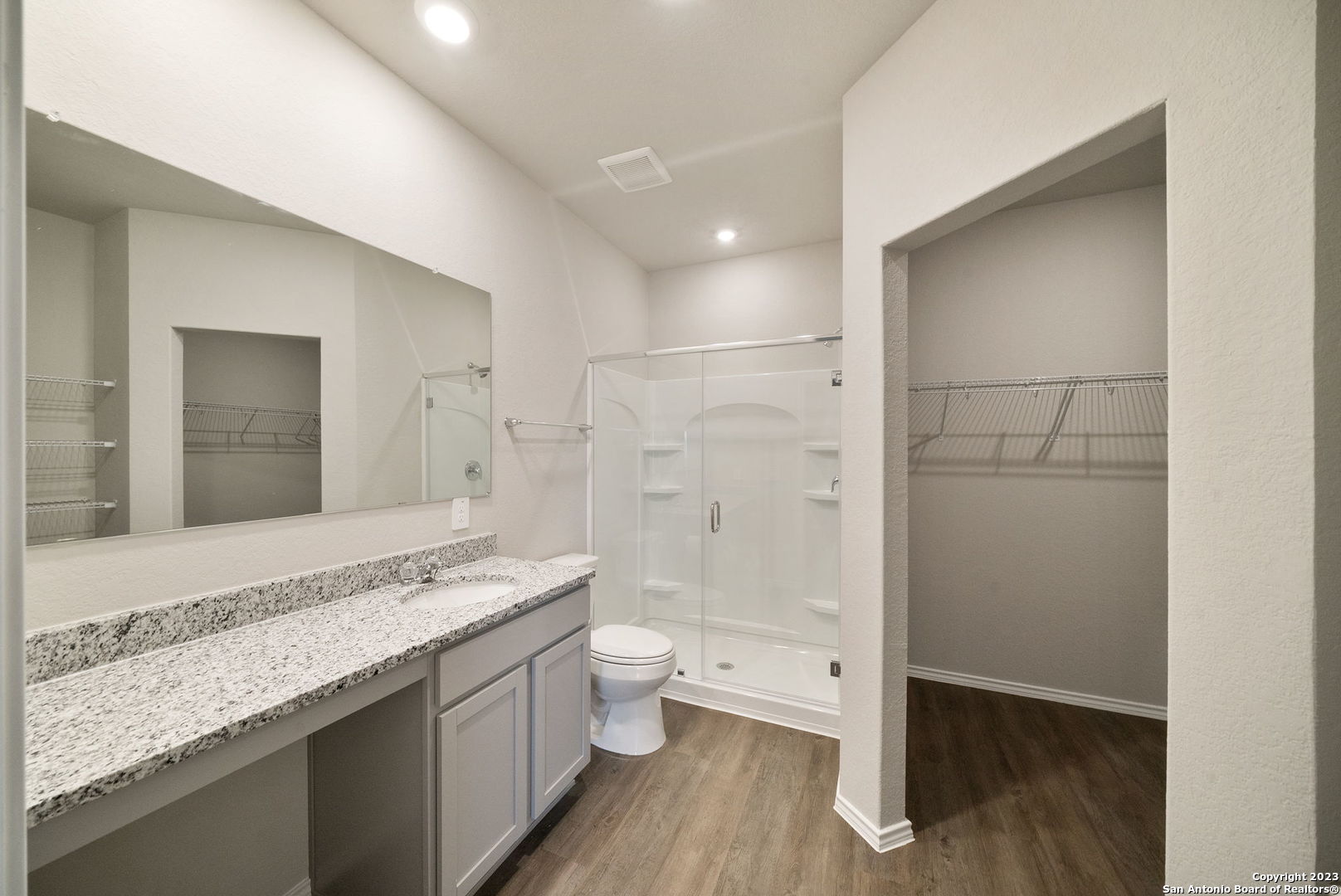 10107 Abrams View Converse, TX 78109 - Photo 15 of 25 a bathroom with a granite countertop sink a toilet and shower