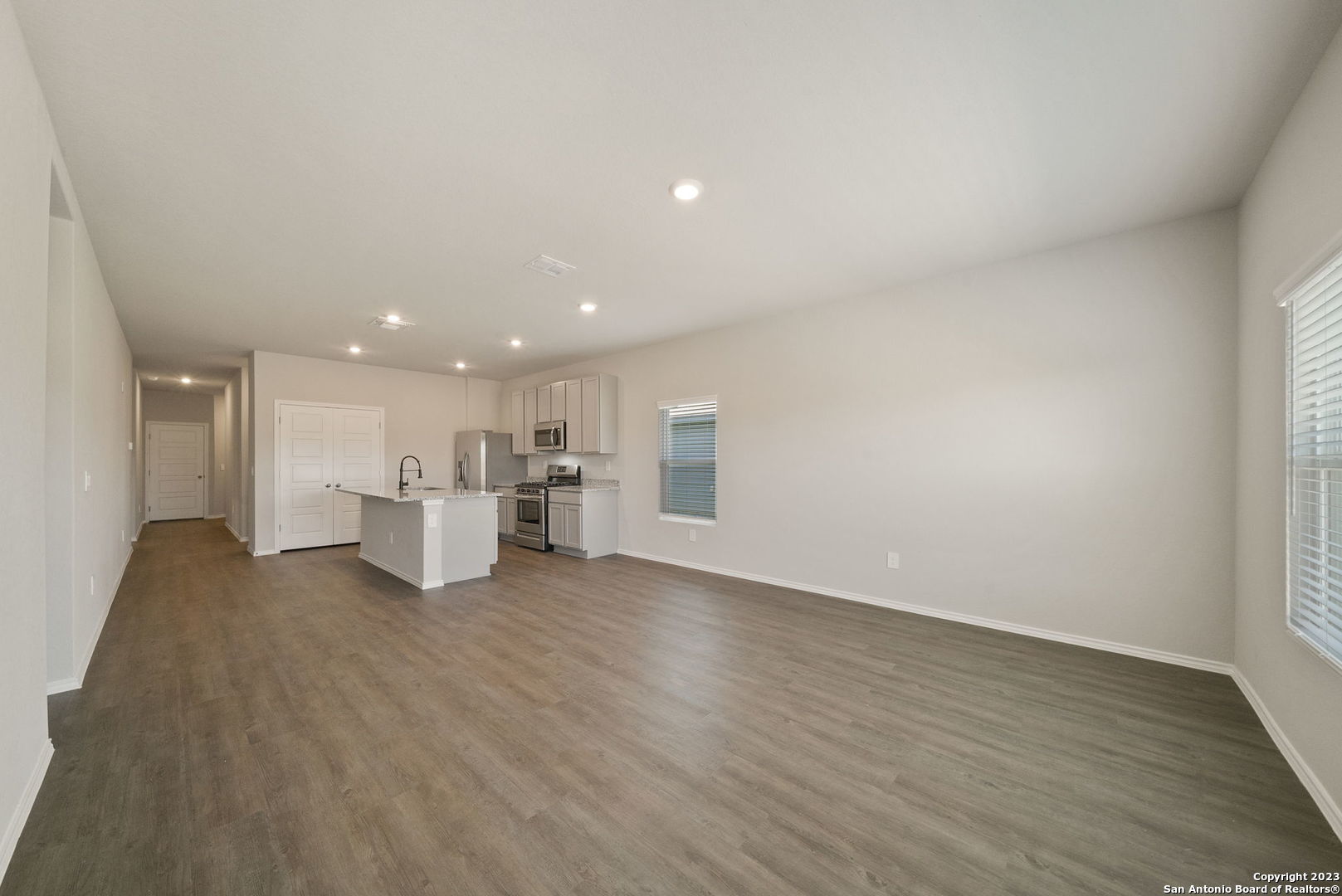 10107 Abrams View Converse, TX 78109 - Photo 8 of 25 a view of a kitchen with a sink and a refrigerator