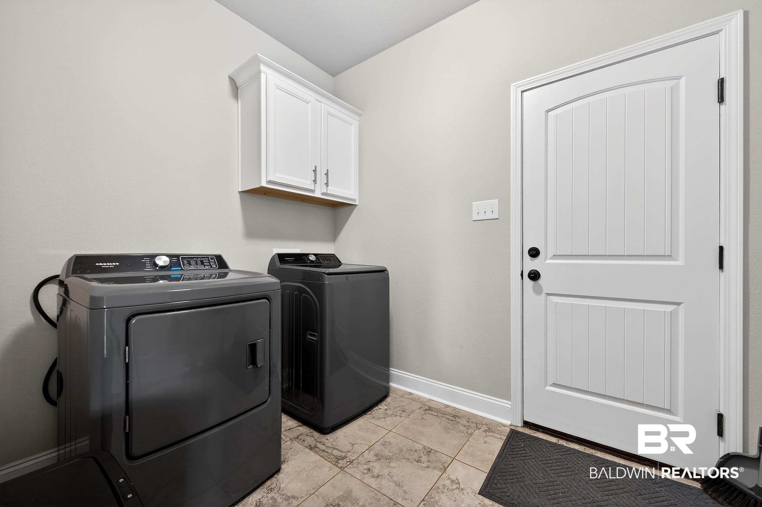 1084 Stella Road Foley, AL 36535 - Photo 27 of 31 Laundry area featuring washing machine and dryer and cabinet space