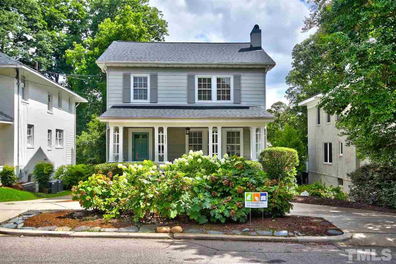 2302 Fairview Road Raleigh, NC 27608 - Photo 1 of 25 a house with a flower garden in front of it