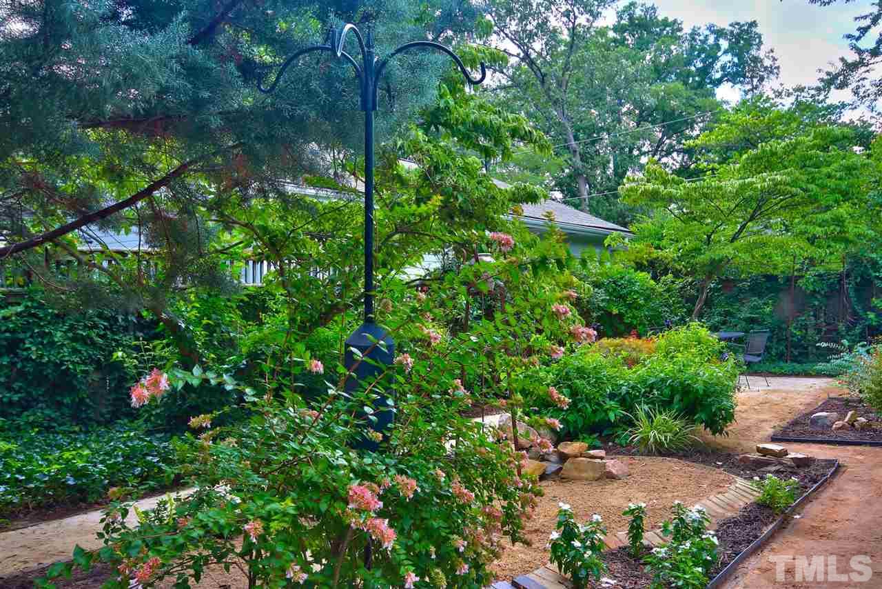 2302 Fairview Road Raleigh, NC 27608 - Photo 17 of 25 a backyard of a house with lots of green space