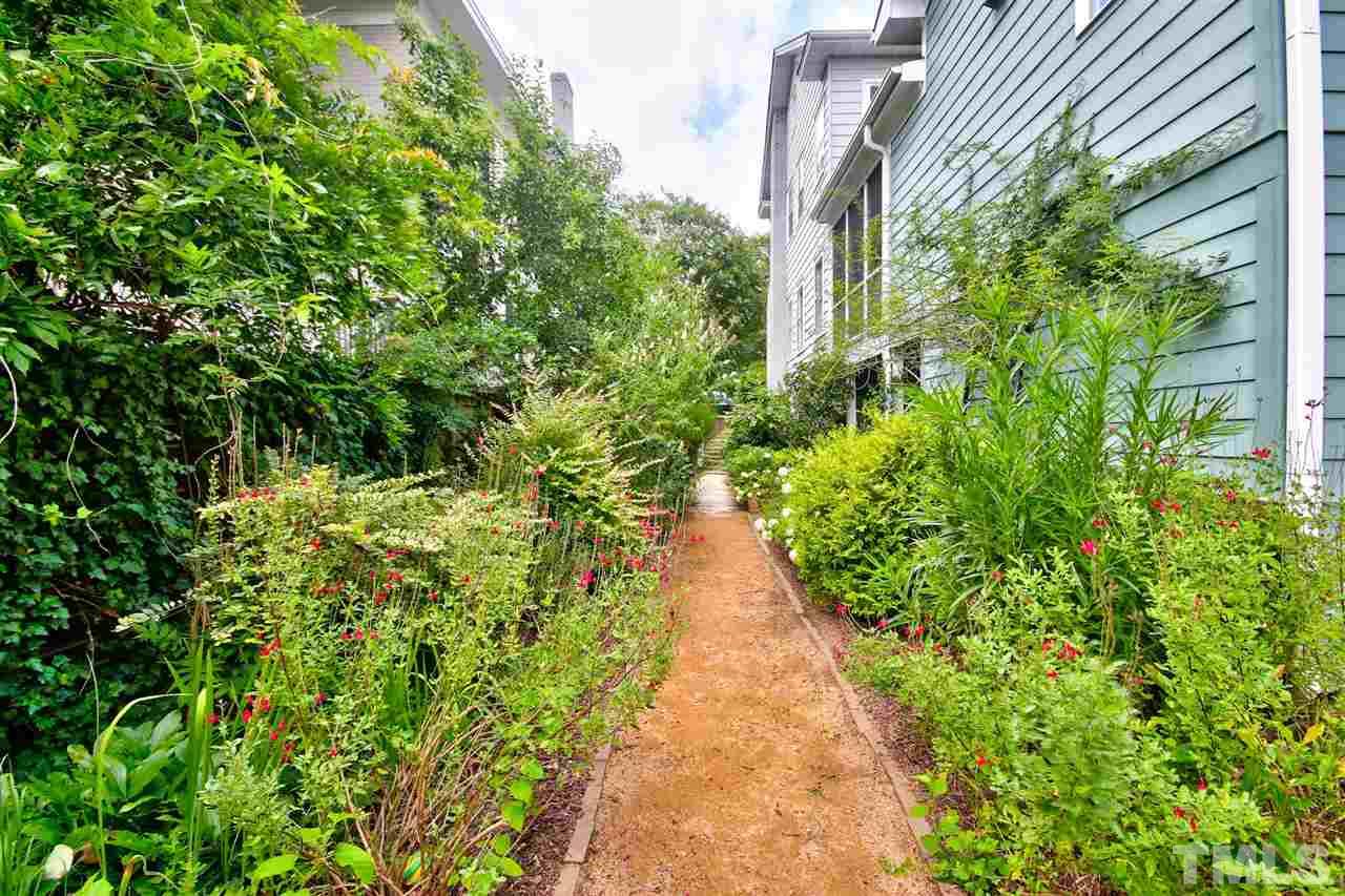 2302 Fairview Road Raleigh, NC 27608 - Photo 18 of 25 a view of a pathway with plants and large trees