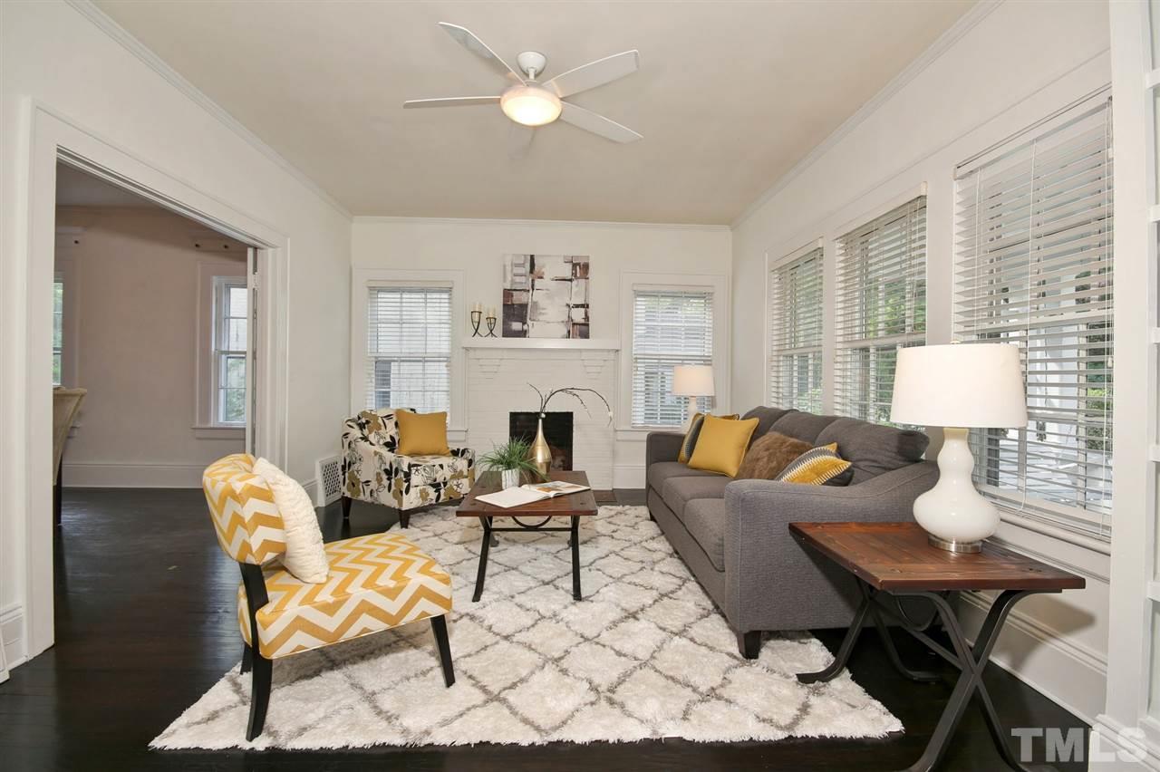 2302 Fairview Road Raleigh, NC 27608 - Photo 5 of 25 a living room with furniture a fireplace and a table