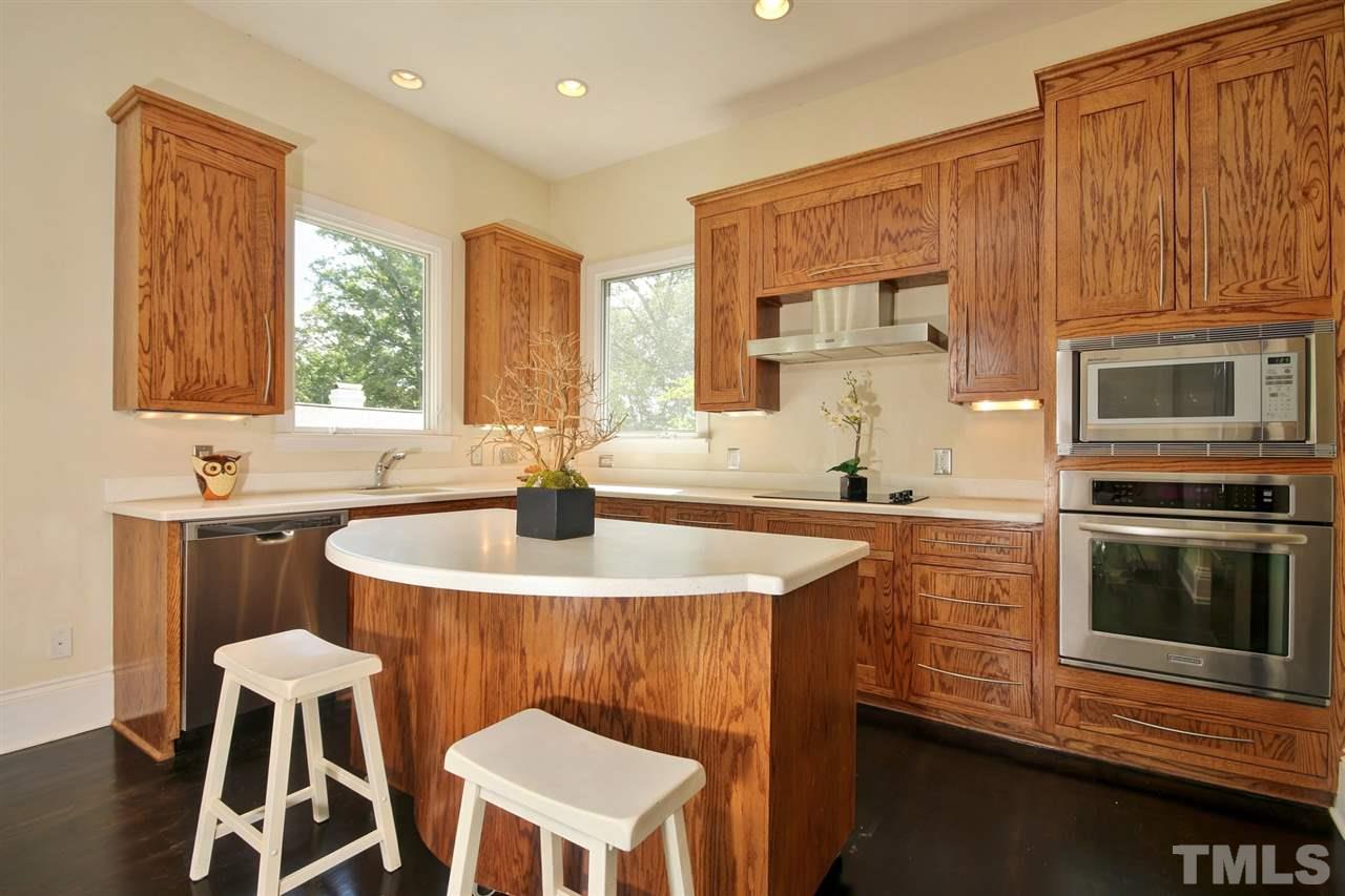 2302 Fairview Road Raleigh, NC 27608 - Photo 9 of 25 a kitchen with a sink cabinets and appliances