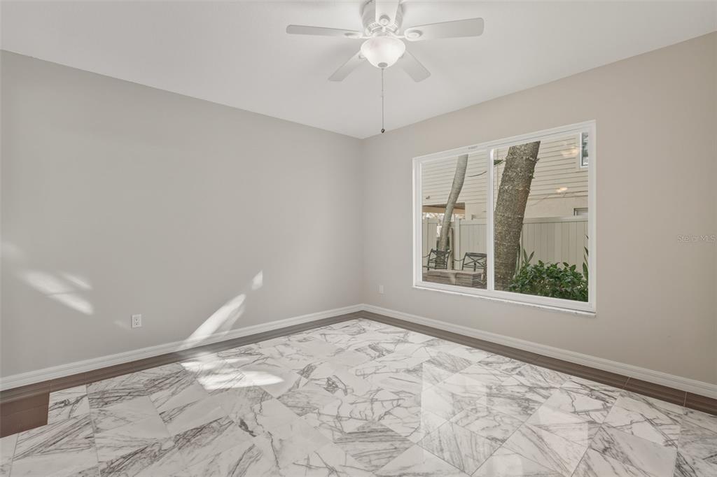 5055 North Beach Road, Unit 106 Englewood, FL 34223 - Photo 18 of 34 a view of an empty room with a window