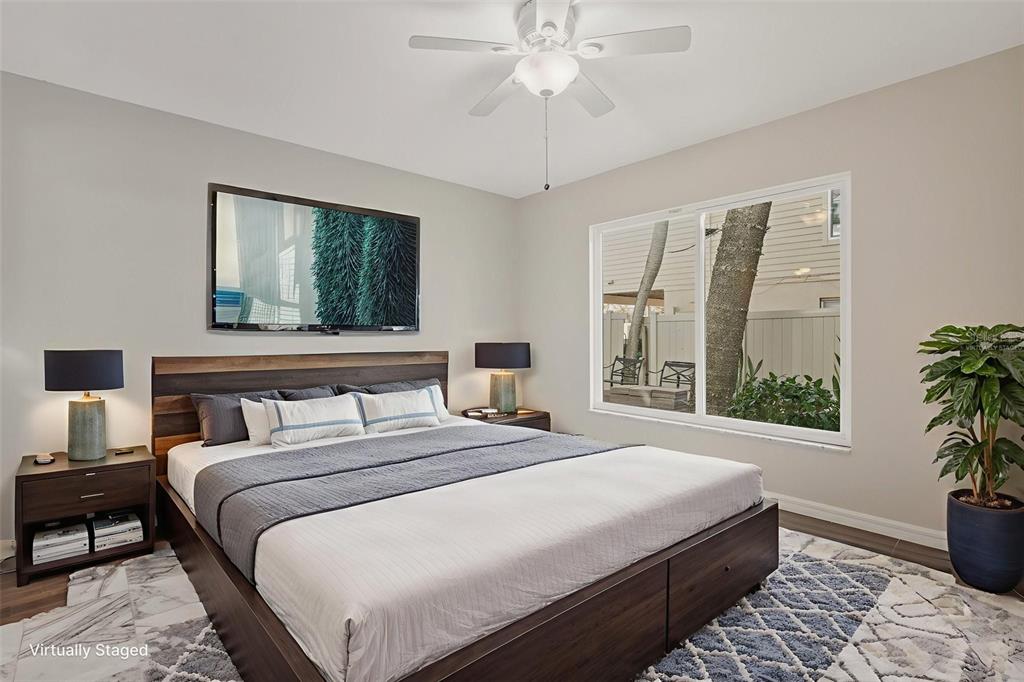 5055 North Beach Road, Unit 106 Englewood, FL 34223 - Photo 19 of 34 a bedroom with bed and window