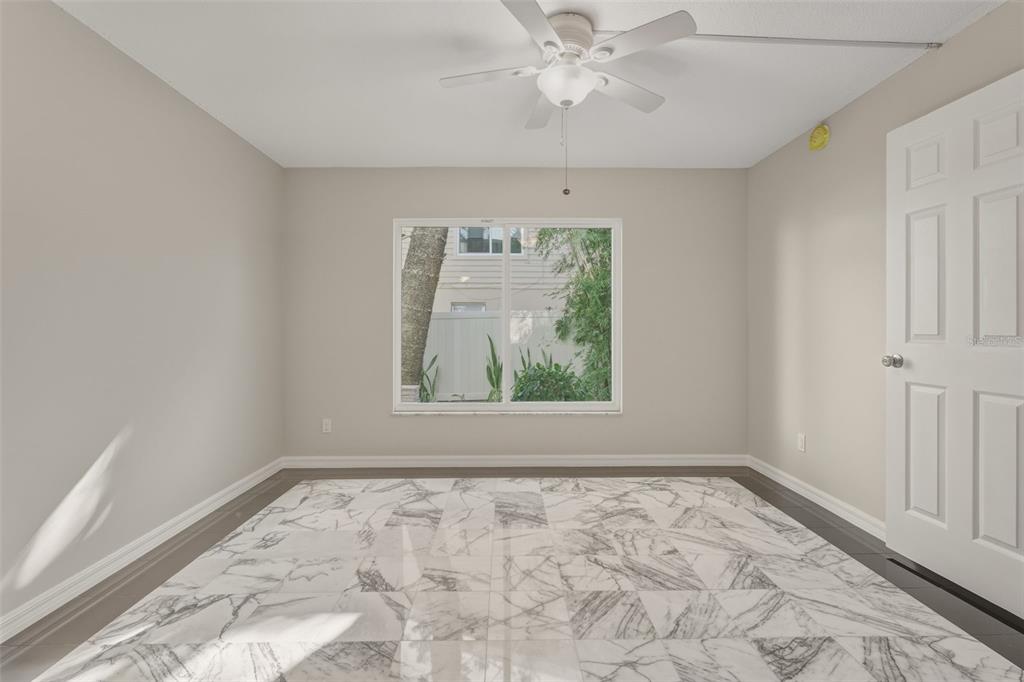 5055 North Beach Road, Unit 106 Englewood, FL 34223 - Photo 20 of 34 an empty room with a window