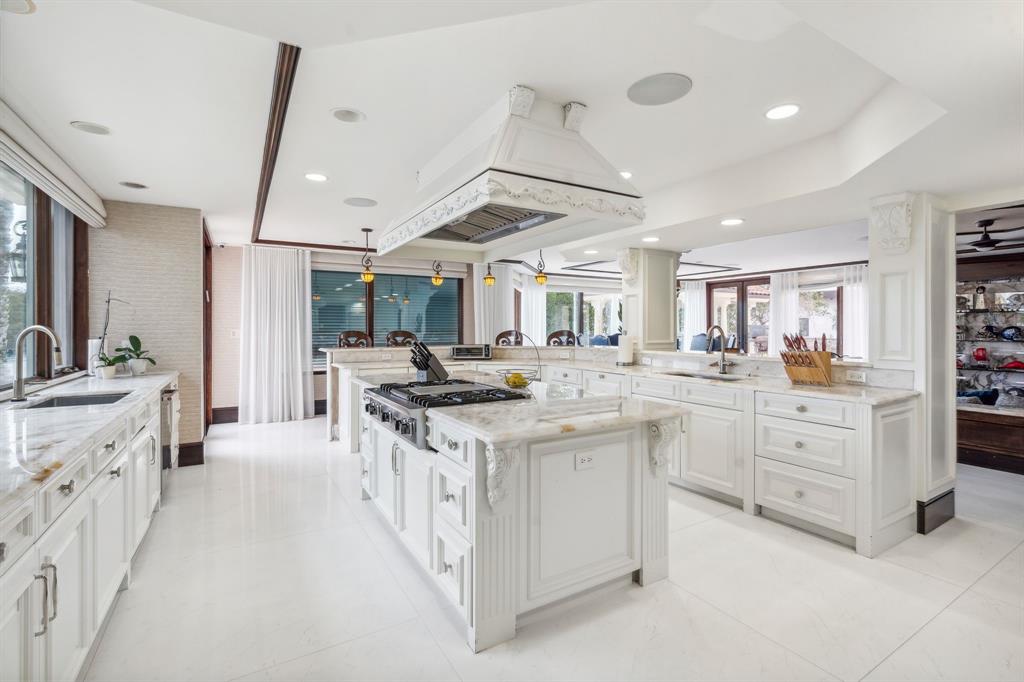 3100 Northeast 46th Street Lighthouse Point, FL 33064 - Photo 13 of 24 a large kitchen with cabinets stove top oven and sink