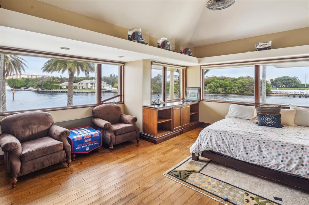 3100 Northeast 46th Street Lighthouse Point, FL 33064 - Photo 20 of 24 a bedroom with furniture and large windows