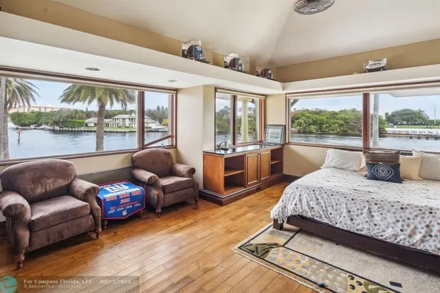 a living room with furniture and pool table