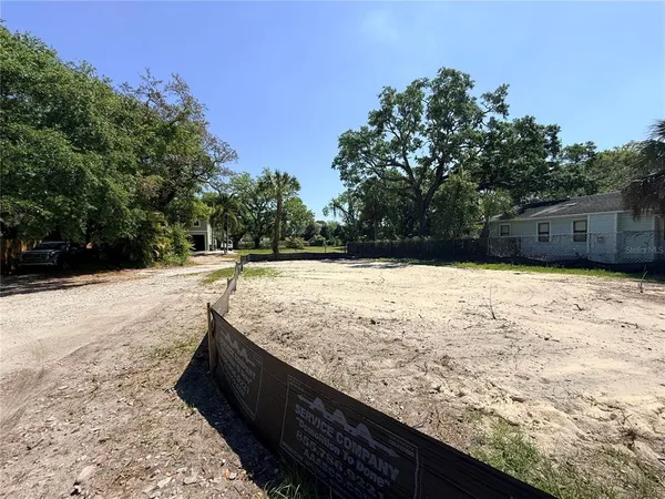 a white vase with flowers