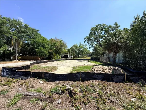 a view of a swimming pool with a yard