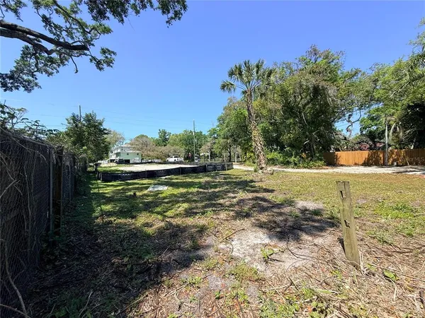 a view of a swimming pool with a yard