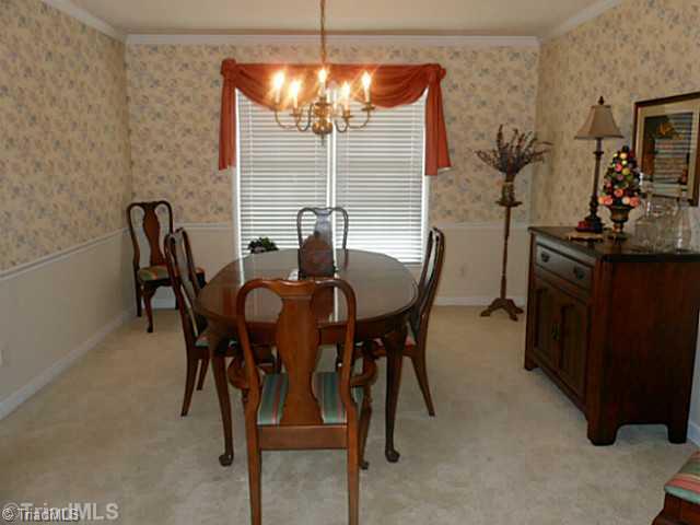 1170 Sweetbriar Road High Point, NC 27262 - Photo 4 of 16 Dining Room. Crown and chair molding ennhance the formal dining room.
