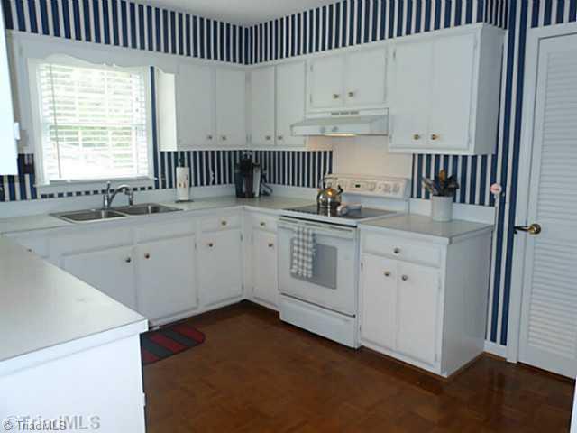 1170 Sweetbriar Road High Point, NC 27262 - Photo 7 of 16 Kitchen. There s abundant cabinet and counter space for the cook! Appliances include a flat surface range and dishwasher.