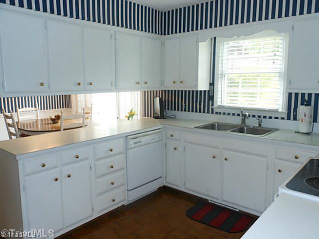 1170 Sweetbriar Road High Point, NC 27262 - Photo 9 of 16 Kitchen. Another view of the kitchen shows the generous cabinet space. There is also a built in desk.
