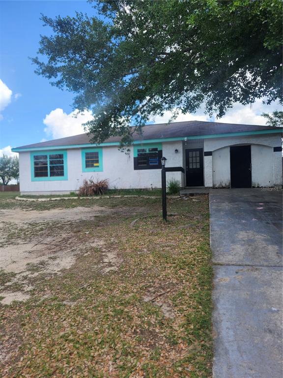 46 Palm Road Ocala, FL 34472 - Photo 2 of 7 a house that has a tree in front of it
