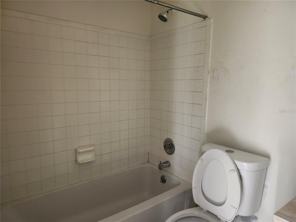 46 Palm Road Ocala, FL 34472 - Photo 6 of 7 a bathroom with a toilet and bathtub
