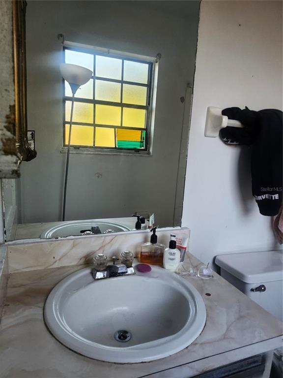 46 Palm Road Ocala, FL 34472 - Photo 7 of 7 a bathroom with a sink and a mirror