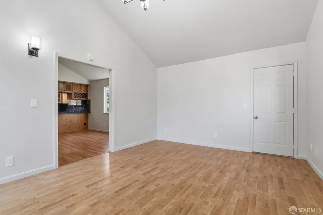 a bedroom with a bed and a potted plant