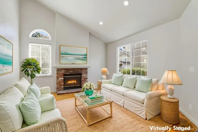 a living room with furniture and a fireplace
