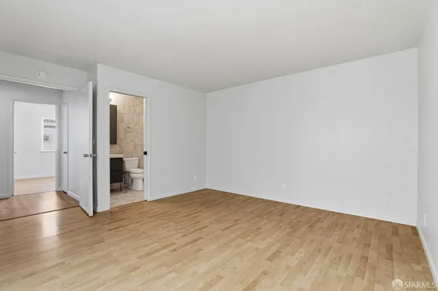 a view of a backyard with wooden fence