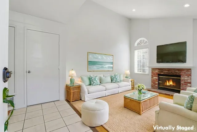 a view of empty room with wooden floor and fireplace