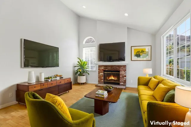 a view of empty room with a fireplace