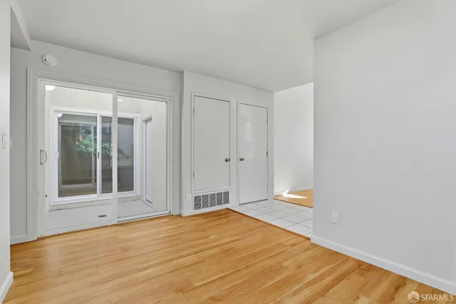 a kitchen with stainless steel appliances granite countertop a sink and a refrigerator